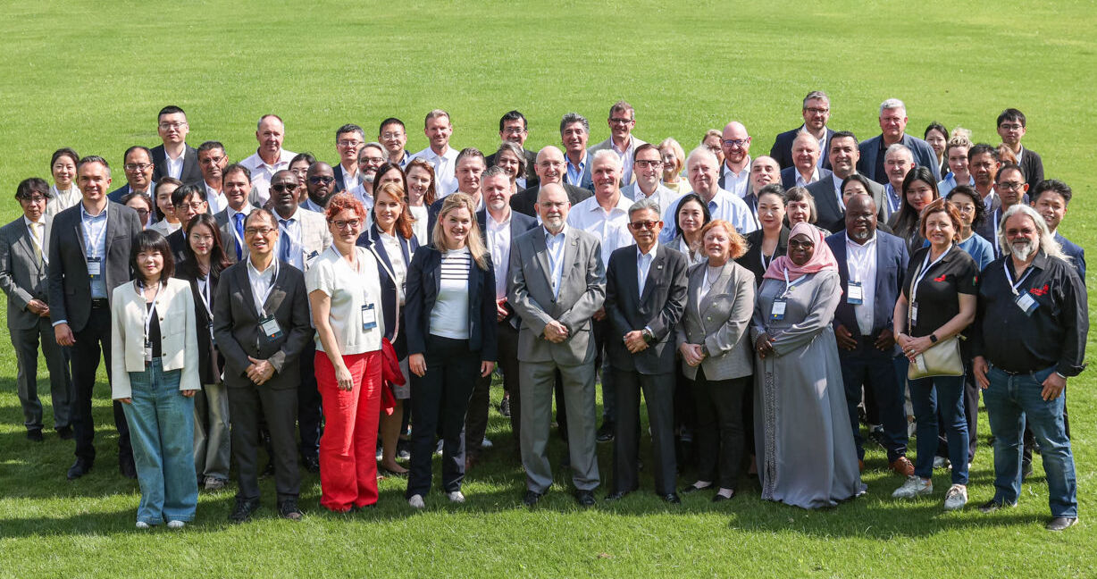 WorldSkills participants, WorldSkills Global Partners, WorldSkills Board members, WorldSkills International Secretariat, observers, and associates standing on a lawn at the Strategic Development Committee Opt-in meeting in Shanghai in May 2024.