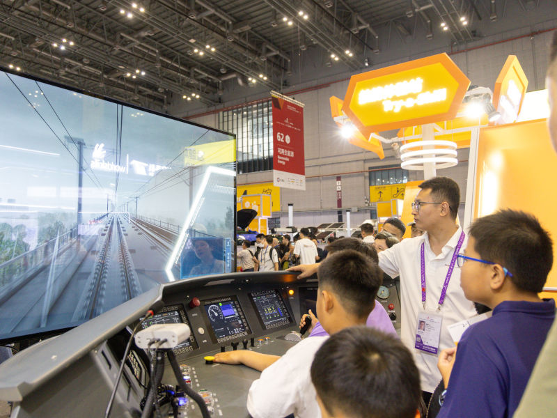 Children experience a rail simulation game, one of the 64 Try-a-Skill stands at WorldSkills Shanghai 2026.