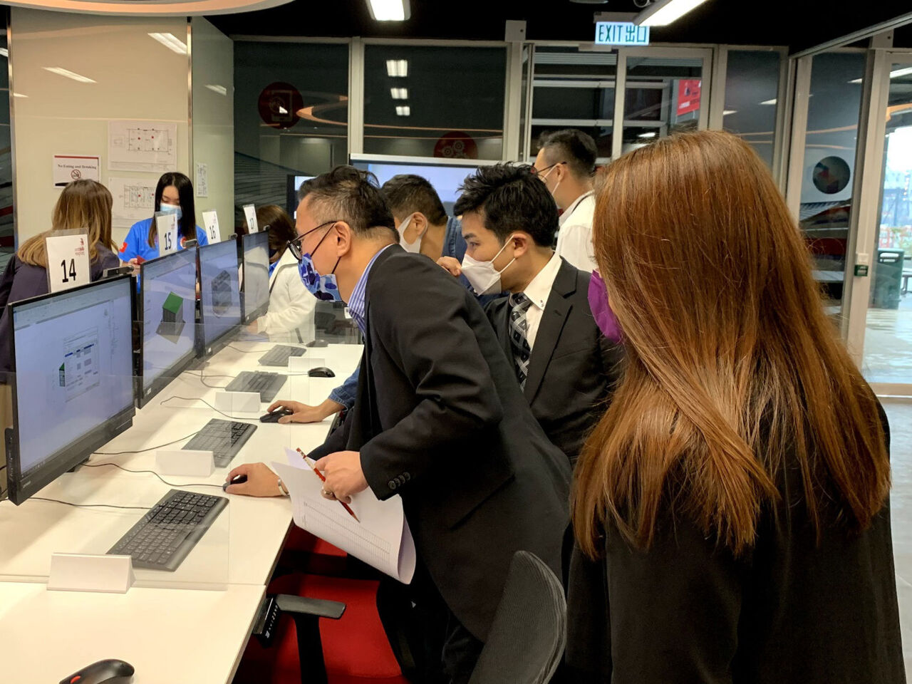 Judges looks at work from the first Building Information Modelling competition by WorldSkills Hong Kong.
