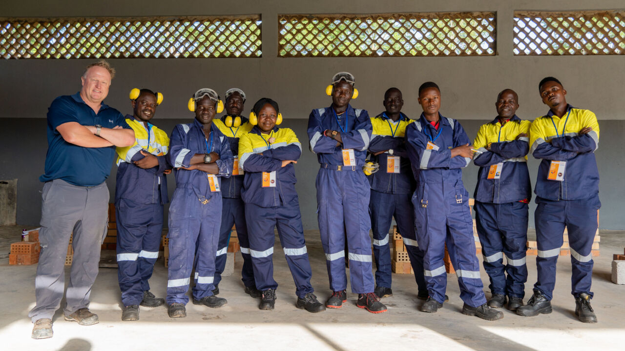 WorldSkills Chief Expert Troy Everett and a group of students at a capacity building skills bootcamp in Uganda.