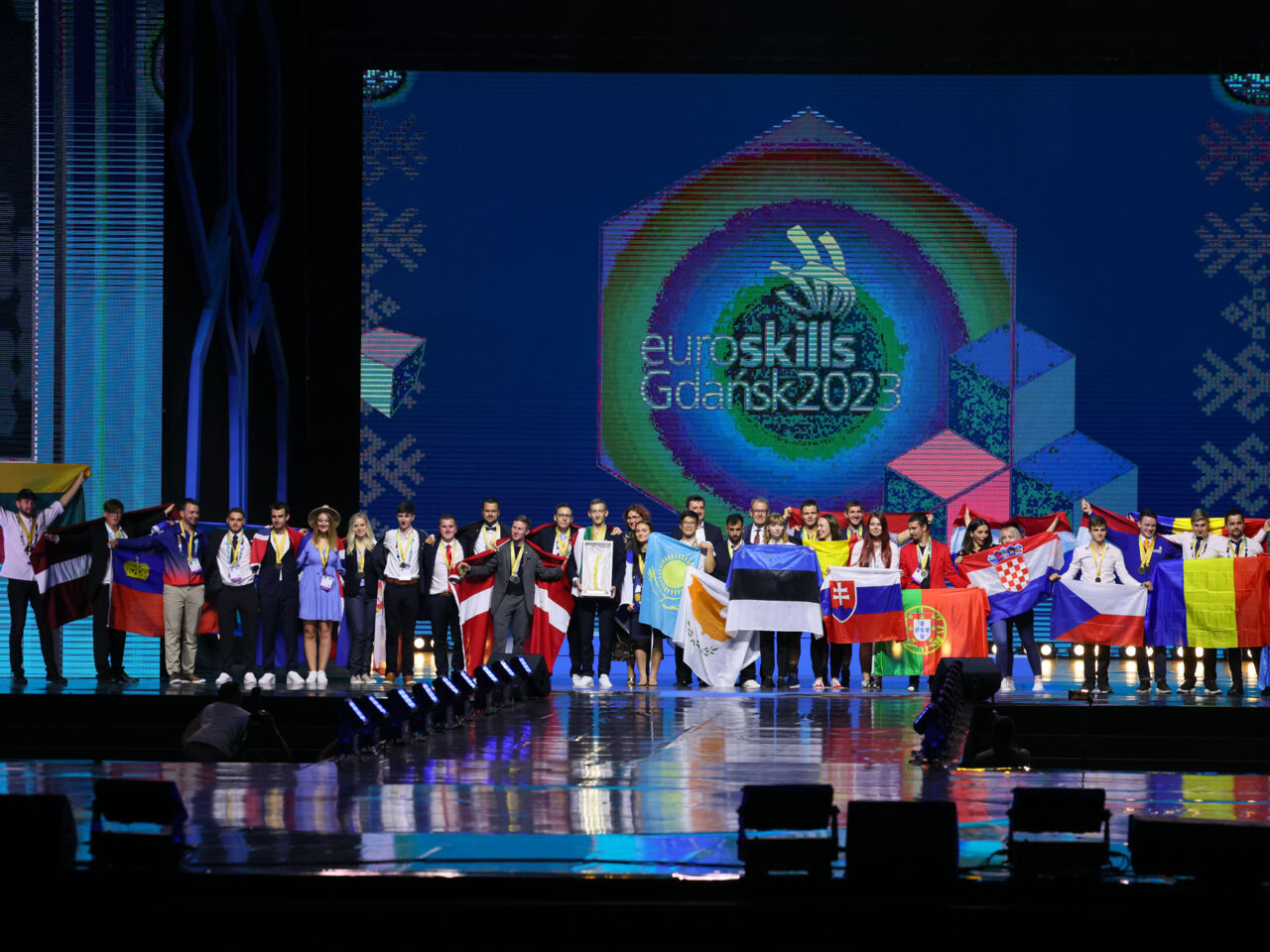 Competitors on stage during the EuroSkills Gdańsk 2023 Closing Ceremony at the Polsat Plus Arena Gdańsk.