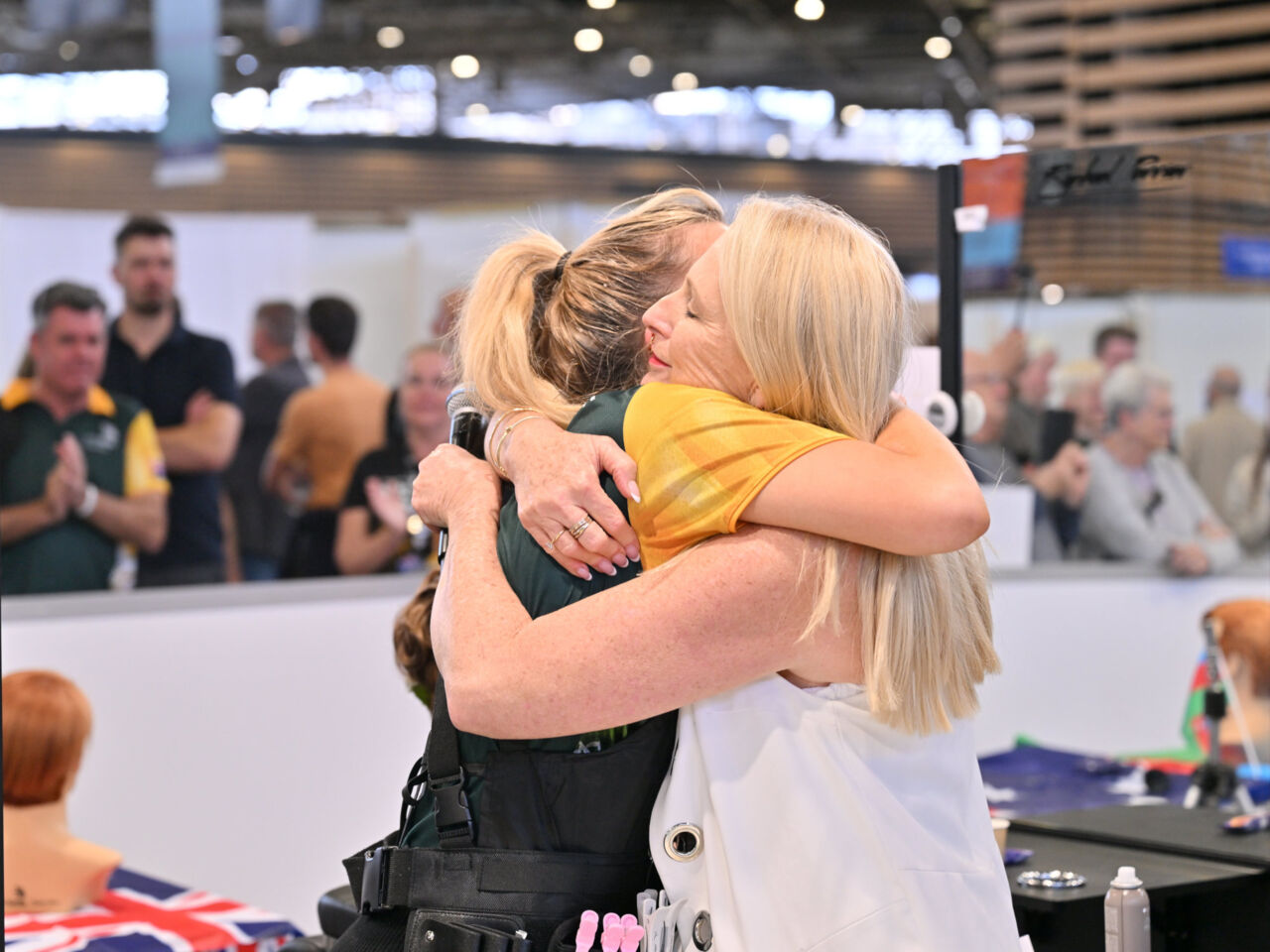 A Competitor and Expert embrace at the end of WorldSkills Lyon 2024.