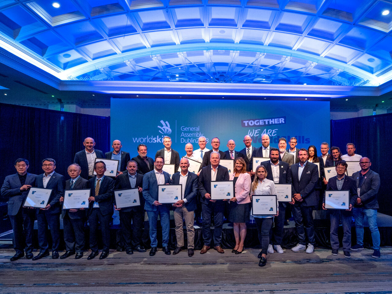 WorldSkills Competition 2022 Special Edition Hosts and Presenting Partner Samsung on stage with certificates recognizing their outstanding contributions to the hosting of the event.
