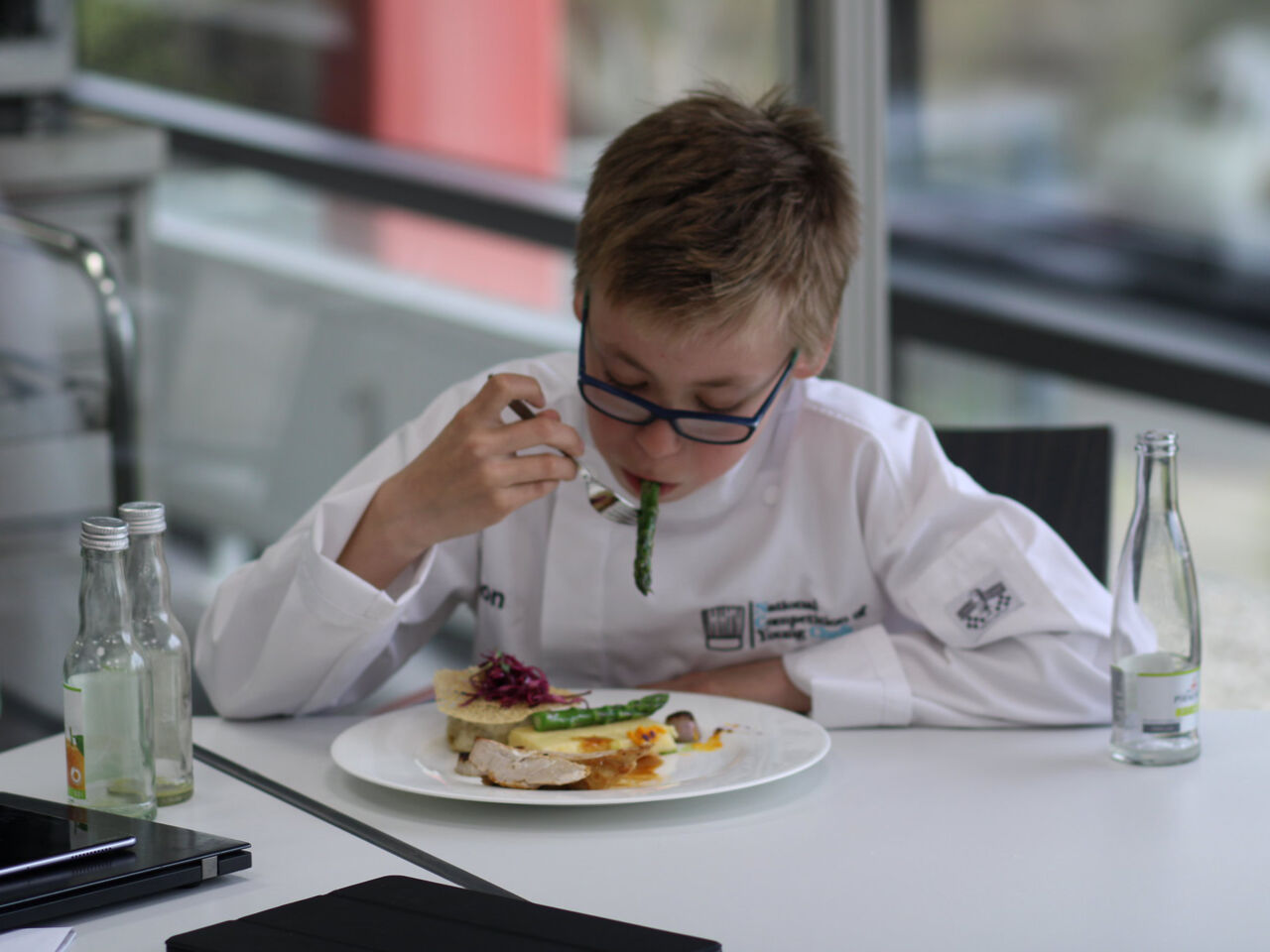 One of the two child judges tasting a dish during the final challenge of National Skills Competition of Young Chefs in Germnay.