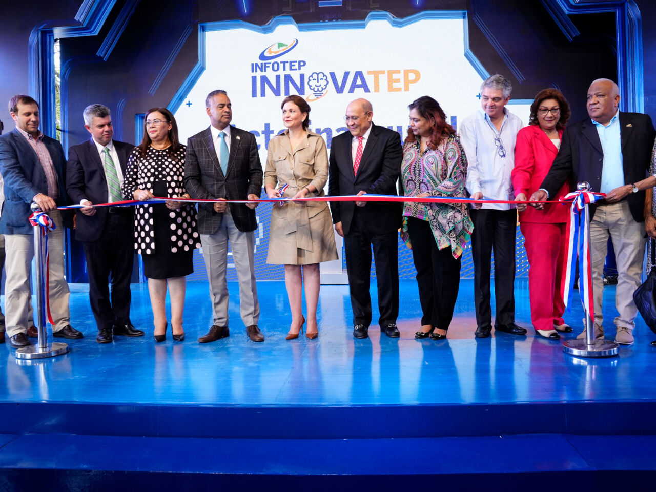 A group cut a ribbon to mark the opening of INNOVATEP2023, a four-day fair last March that brought together educators, policymakers, industry, and youth in Santo Domingo.