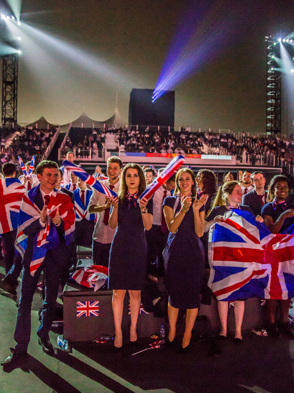 Dan McCabe celebrating with teammates from the United Kingdom at the closing ceremony of WorldSkills Abu Dhabi 2017.