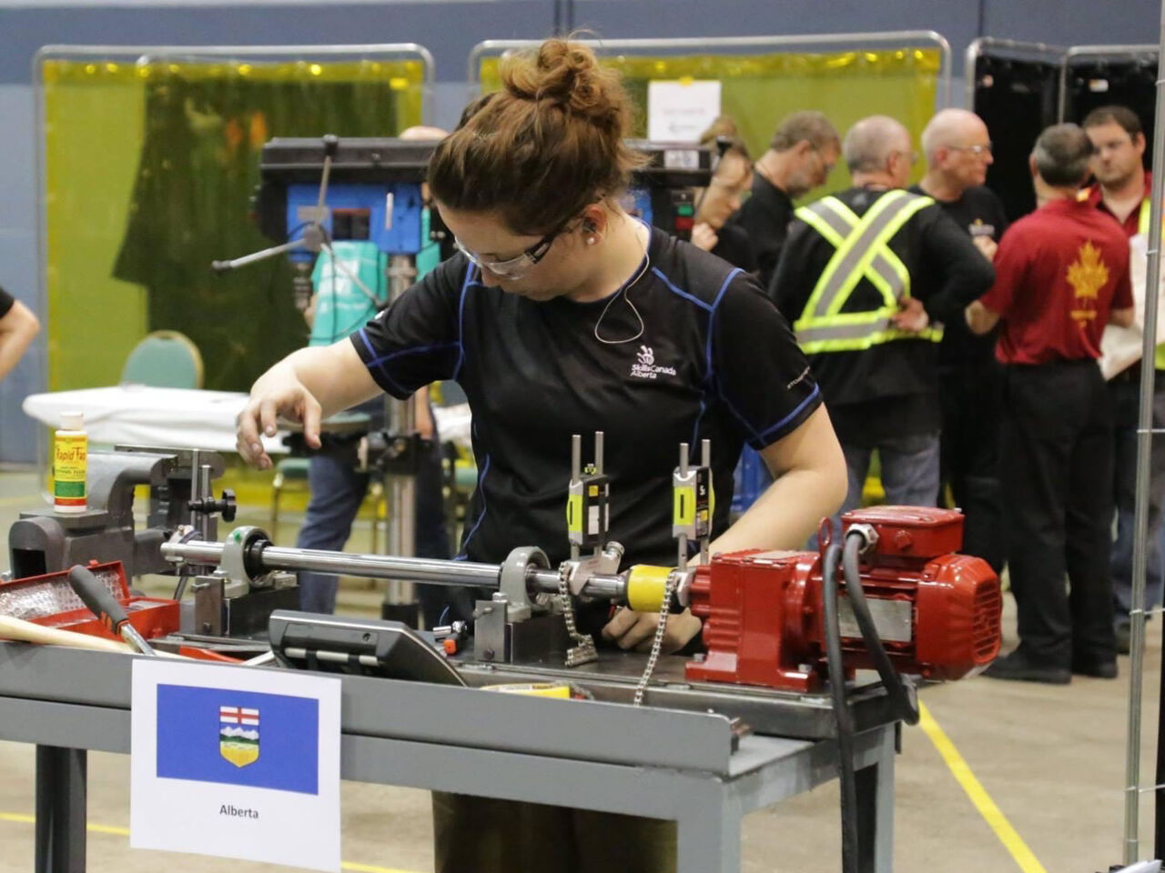 Deanna Reynolds competing for Alberta in an Industrial Mechanic Millwrights skills competition.