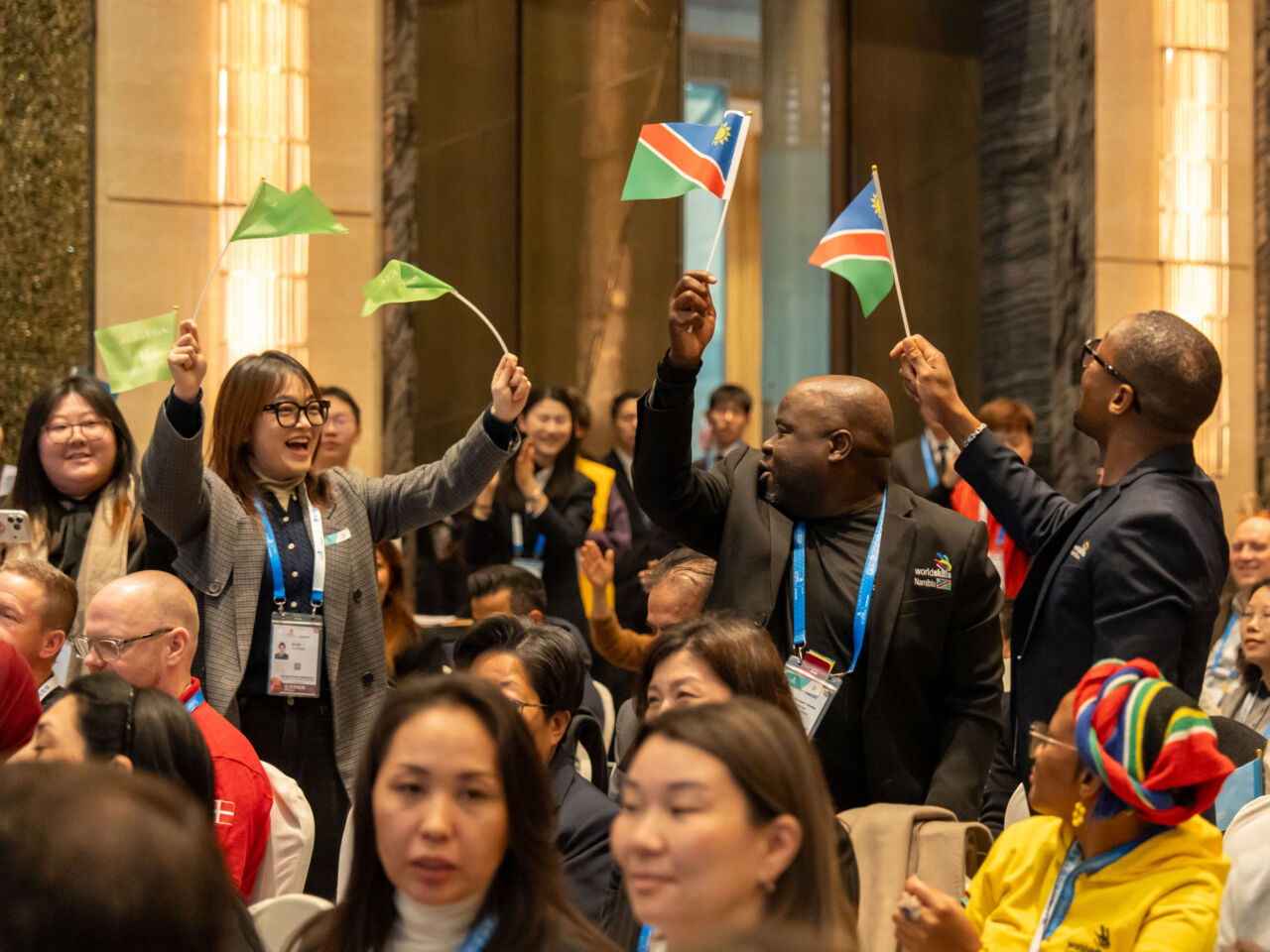 Participants wave flags during the launch of One School One Member during Competition Preparation Week in Shanghai, China on 4 February 2026.