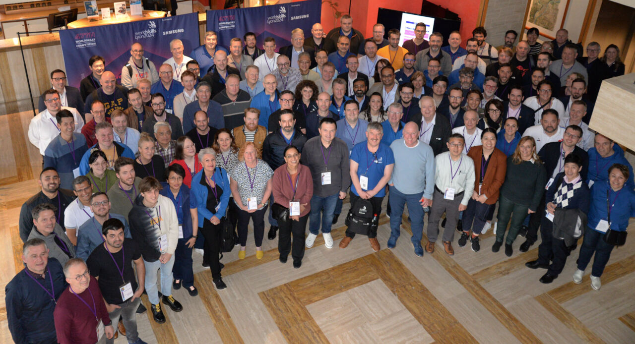 Group photo from above of Skill Competition Managers, Workshop Managers, Workshop Sector Managers, Global Partners, and sponsors from 60 skill competitions who met in Lyon, France from 17 to 19 March.