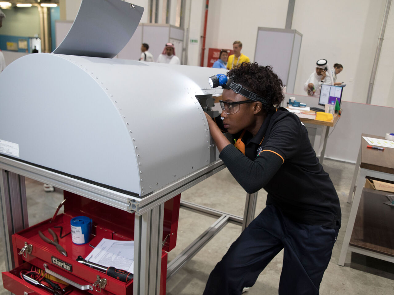 Euphrasia Mulenga competed at WorldSkills Abu Dhabi 2017 examining an aircraft engine.